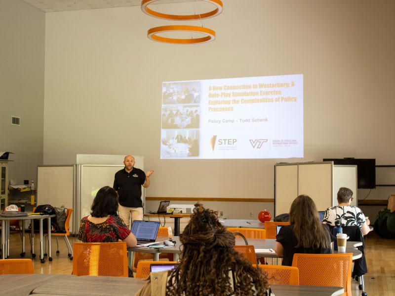 Todd Schenk presents to 2024 policy camp participants